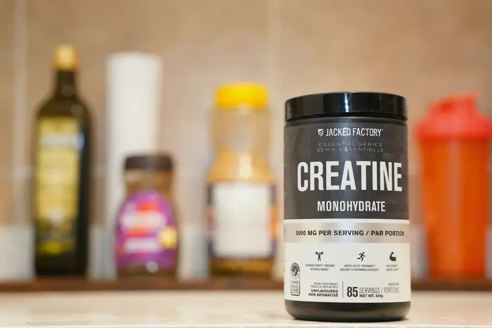 Close-up of a supplement bottle&#x27;s ingredient label being read