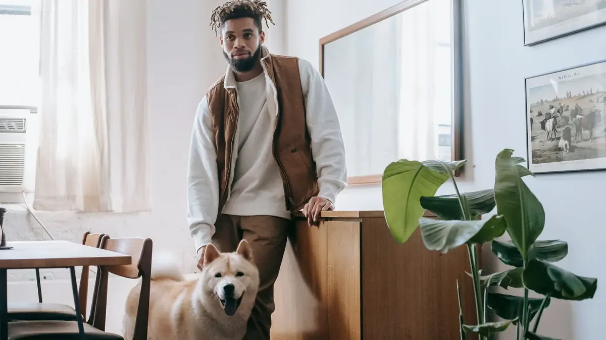 Dog in a kitchen with an owner
